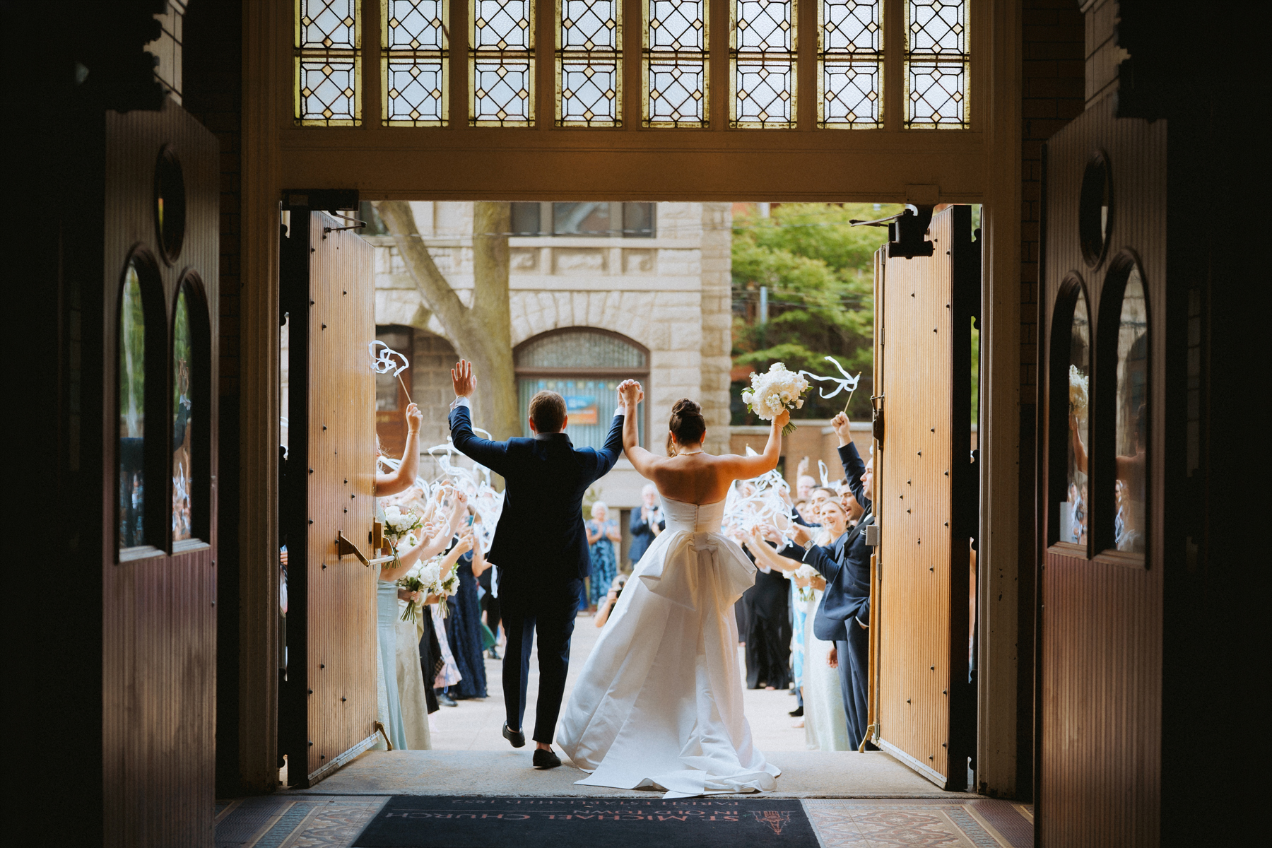 Bride and groom celebrate ceremony exit