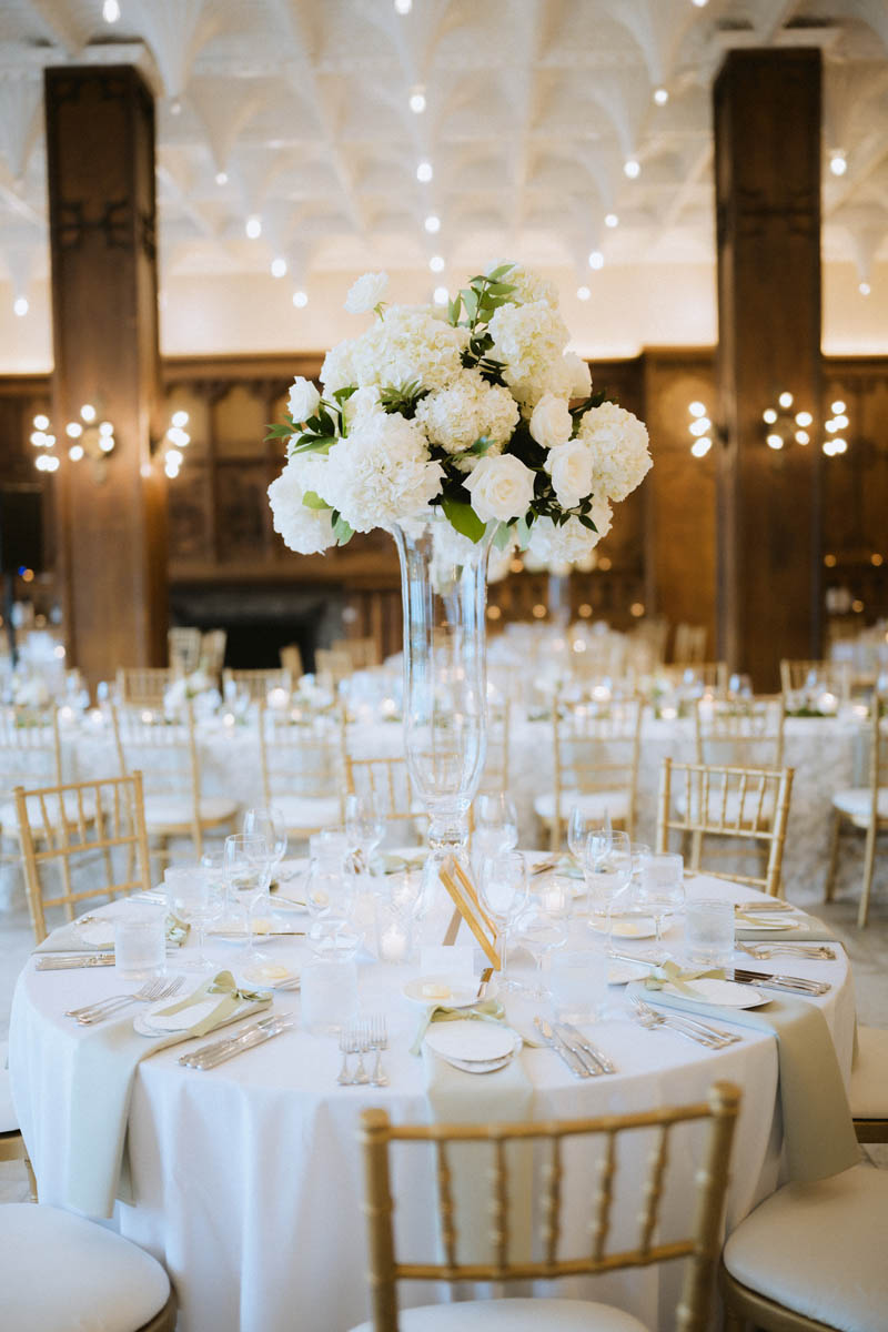 White wedding flowers and reception tables at the Chicago Athletic Association Hotel