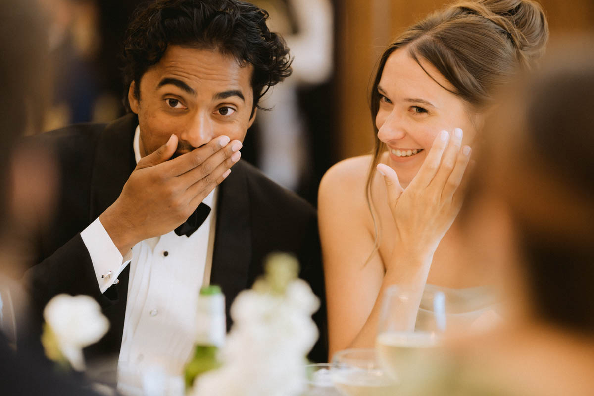 Wedding guests laughing together at the Chicago Athletic Association Hotel reception