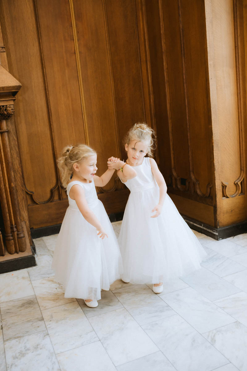Little flower girls dancing at the reception