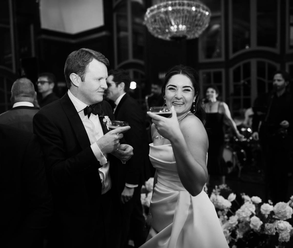 Bride and groom laughing together during their Chicago Athletic Association Hotel reception