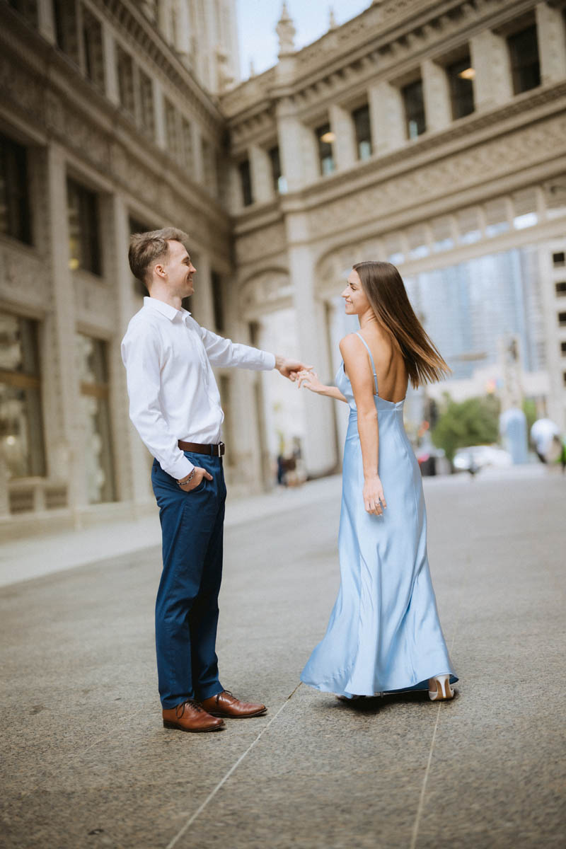 Couple dancing near Chicago Wrigley Building