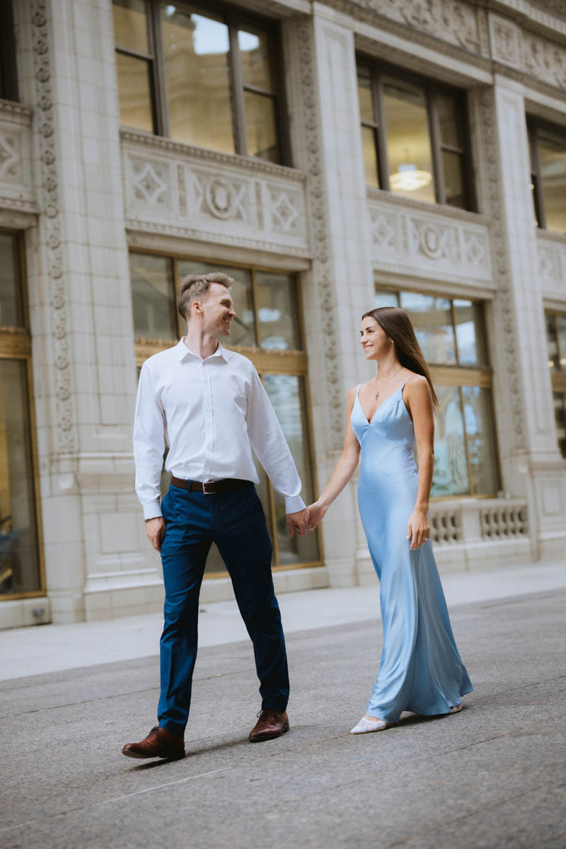 Couple walking by the Wrigley Building